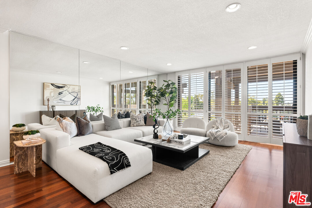 8640 Gulana Avenue, Unit K3017 Playa del Rey, CA 90293 - Photo 1 of 19 a living room with furniture and a large window
