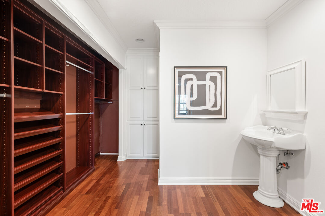 8640 Gulana Avenue, Unit K3017 Playa del Rey, CA 90293 - Photo 11 of 19 a view of a hallway with wooden floor and closet