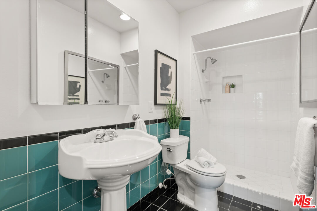 8640 Gulana Avenue, Unit K3017 Playa del Rey, CA 90293 - Photo 13 of 19 a bathroom with a toilet sink and mirror