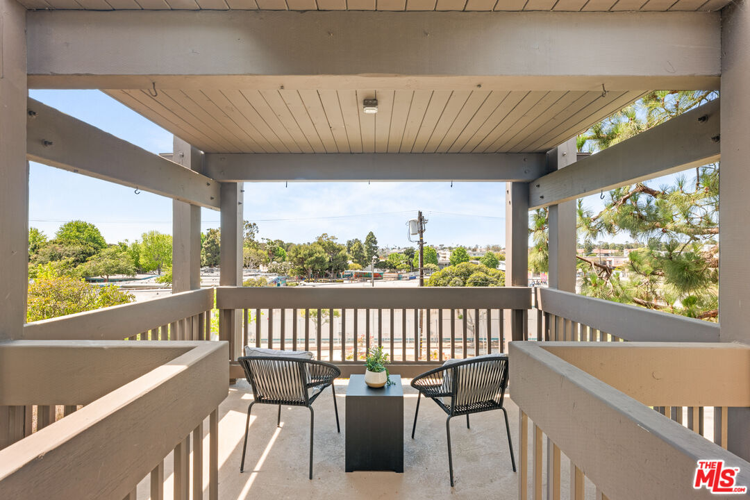 8640 Gulana Avenue, Unit K3017 Playa del Rey, CA 90293 - Photo 16 of 19 a view of a balcony with wooden floor