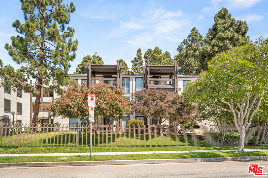 8640 Gulana Avenue, Unit K3017 Playa del Rey, CA 90293 - Photo 18 of 19 a front view of a house with a yard