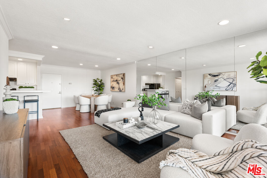 8640 Gulana Avenue, Unit K3017 Playa del Rey, CA 90293 - Photo 2 of 19 a living room with furniture and wooden floor