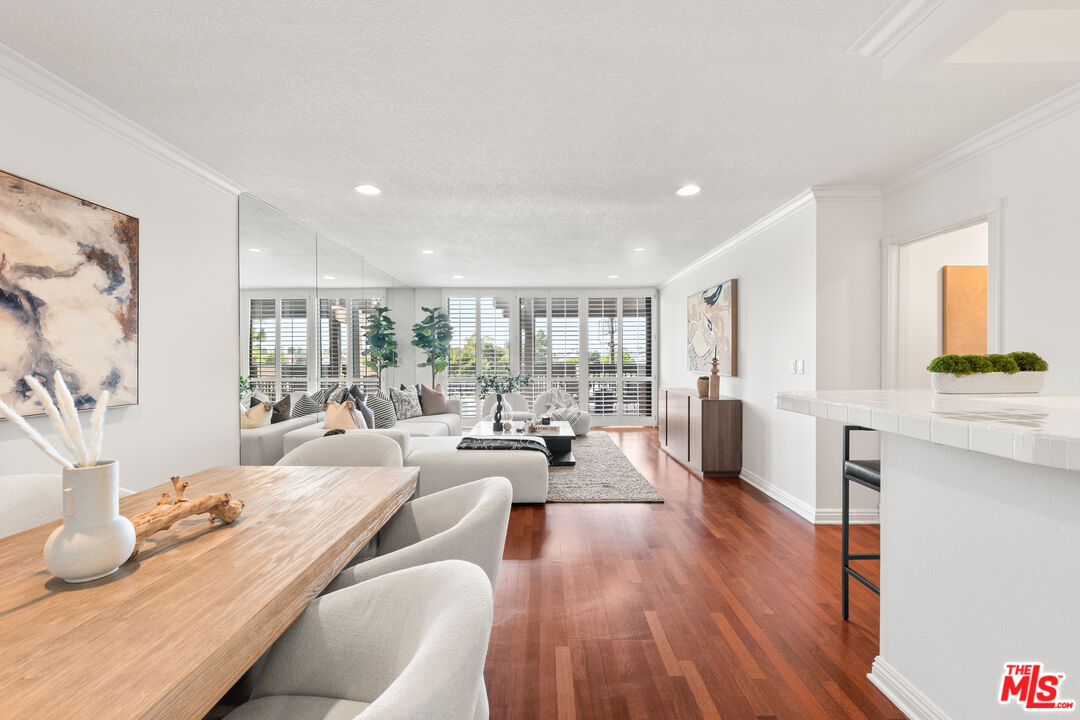 8640 Gulana Avenue, Unit K3017 Playa del Rey, CA 90293 - Photo 3 of 19 a living room with furniture and a wooden floor