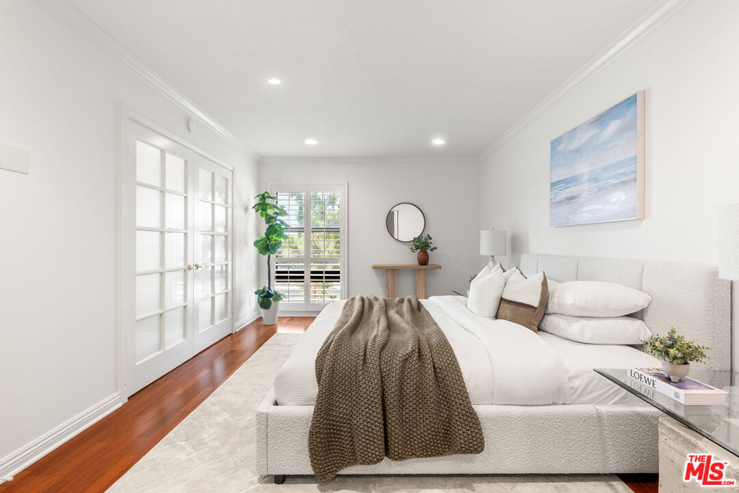 8640 Gulana Avenue, Unit K3017 Playa del Rey, CA 90293 - Photo 8 of 19 a bedroom with furniture and a large window