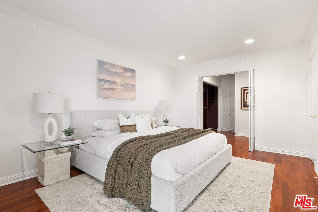 8640 Gulana Avenue, Unit K3017 Playa del Rey, CA 90293 - Photo 9 of 19 a bedroom with bed and a night stand