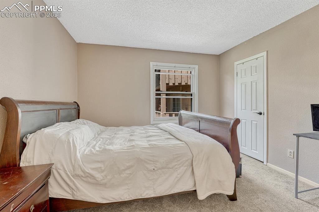 1661 Deer Creek Road Monument, CO 80132 - Photo 21 of 48 Bedroom 2 on main with walk in closet