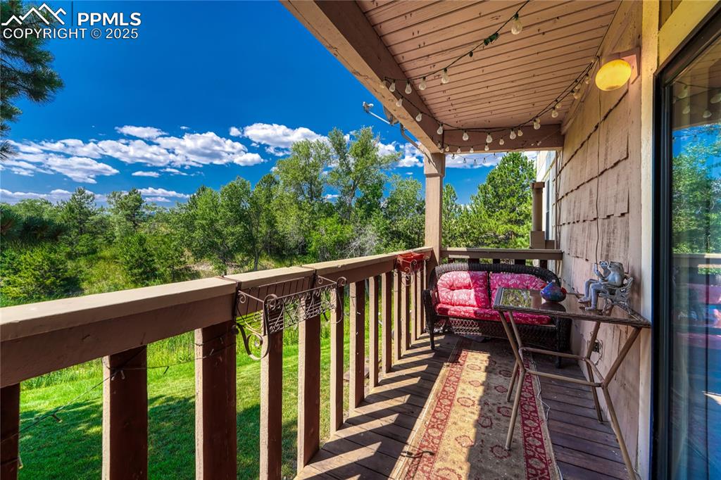 1661 Deer Creek Road Monument, CO 80132 - Photo 34 of 48 balcony with lake and mountain views