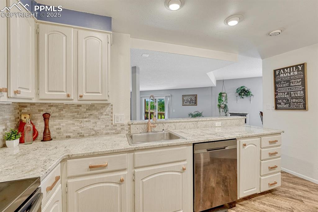 1661 Deer Creek Road Monument, CO 80132 - Photo 6 of 48 Kitchen looking into living and dining room