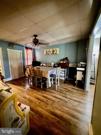 a living room with lots of furniture and gym equipment