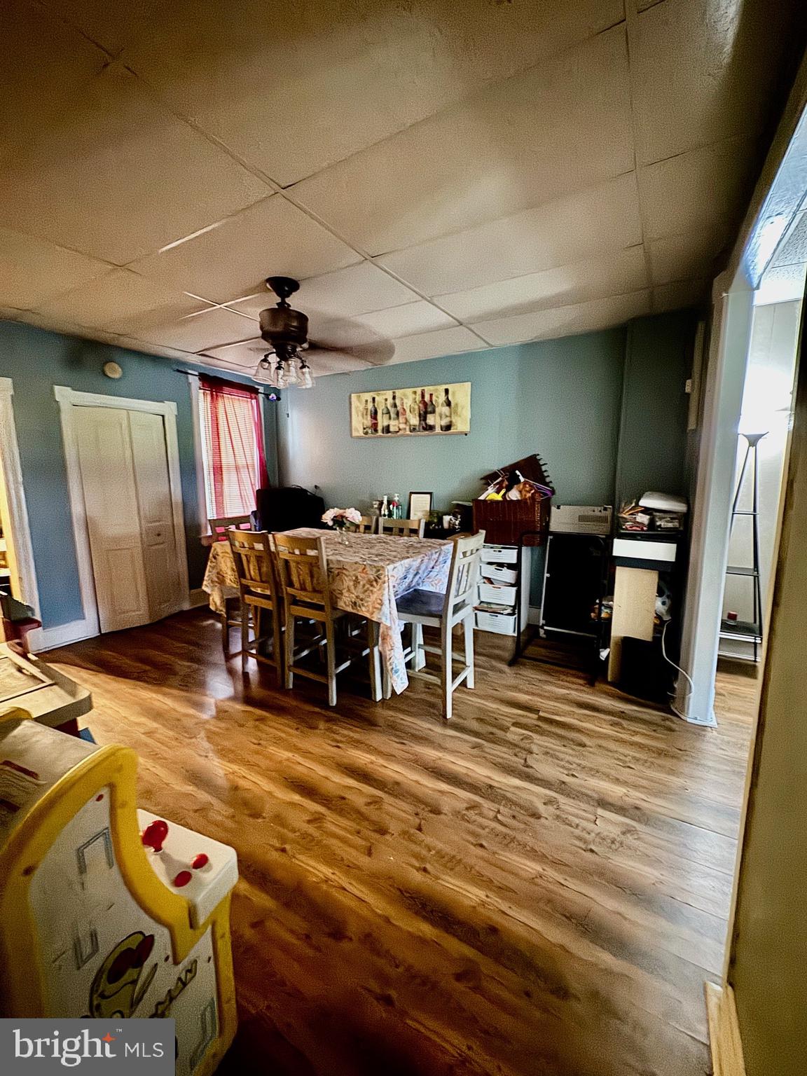 209 Willow Street Delanco, NJ 08075 - Photo 4 of 14 a living room with lots of furniture and gym equipment