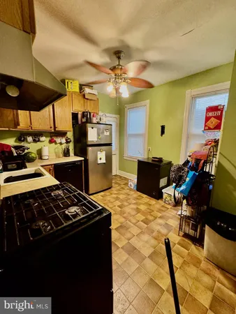 a kitchen with a table and chairs