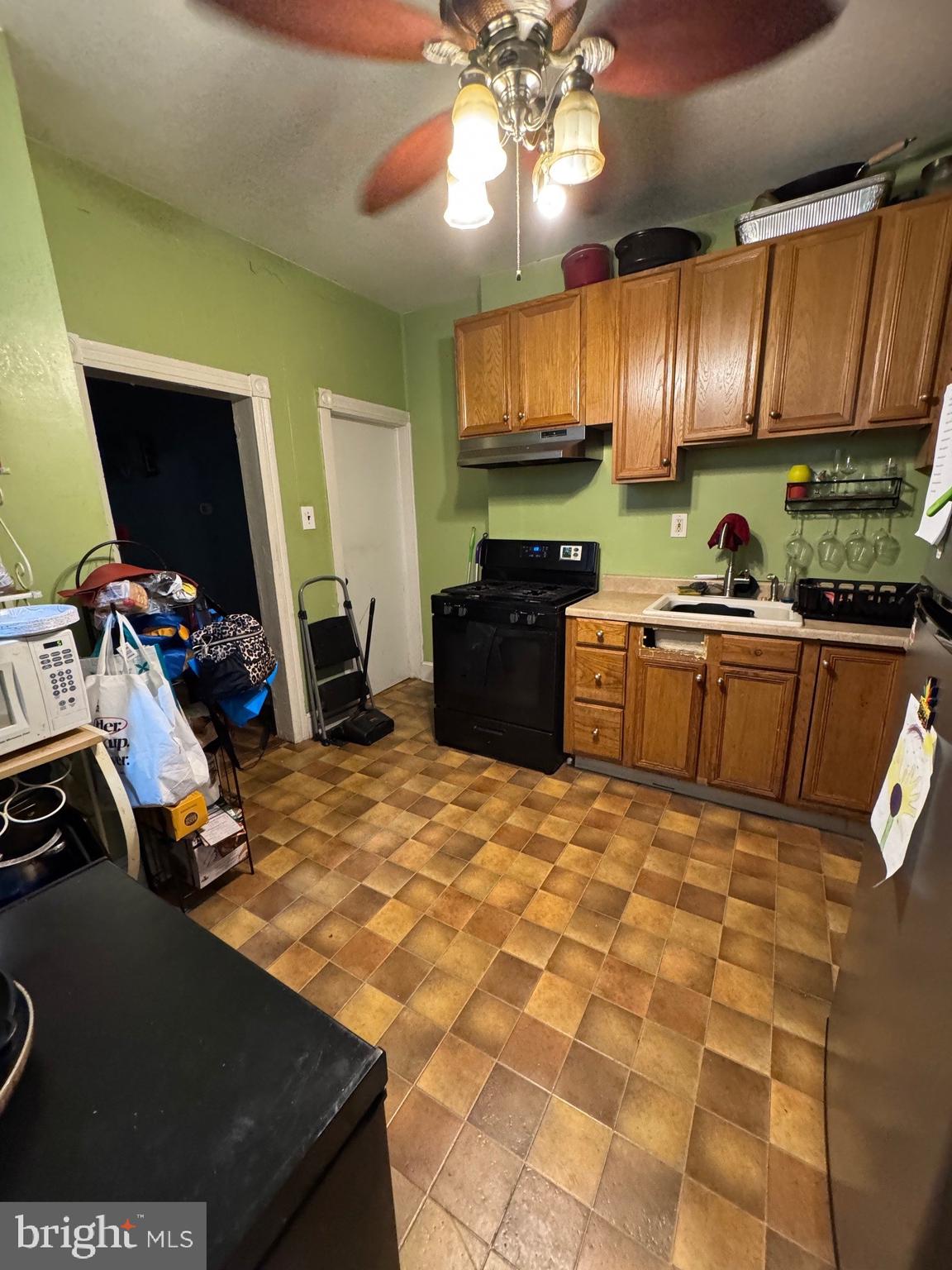 209 Willow Street Delanco, NJ 08075 - Photo 6 of 14 a kitchen with kitchen island granite countertop a sink appliances and cabinets