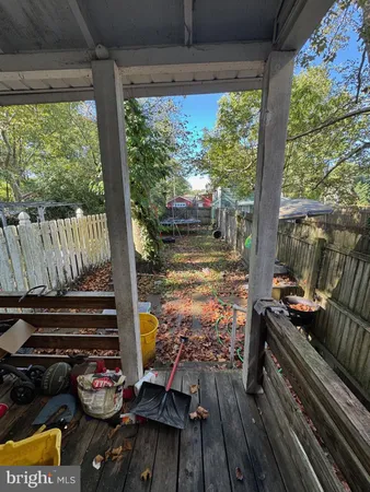 a view of a patio with wooden floor and outdoor seating