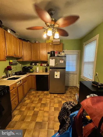 a kitchen with stainless steel appliances granite countertop a sink counter space cabinets and a sink