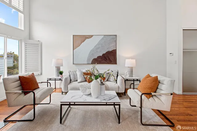 a living room with furniture and a rug