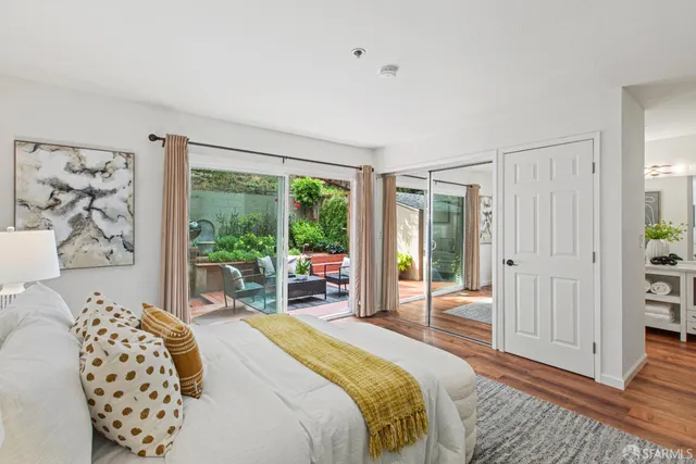 a bedroom with a bed and a desk