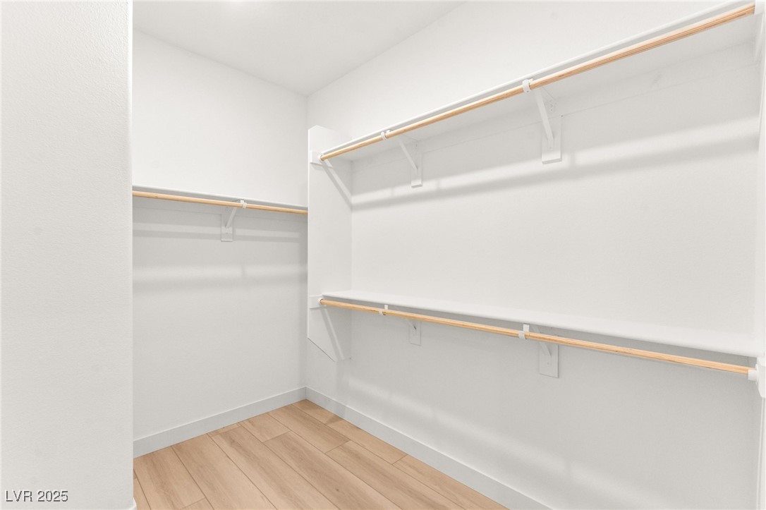 5606 Spring Trellis Street Las Vegas, NV 89113 - Photo 29 of 44 Walk in closet with light wood-type flooring