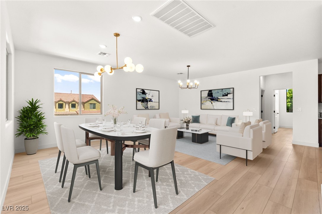 5606 Spring Trellis Street Las Vegas, NV 89113 - Photo 4 of 44 Dining space with a chandelier, light wood-style flooring, and recessed lighting
