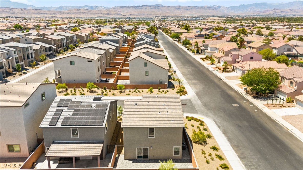 5606 Spring Trellis Street Las Vegas, NV 89113 - Photo 42 of 44 Aerial view of residential area featuring a mountain backdrop