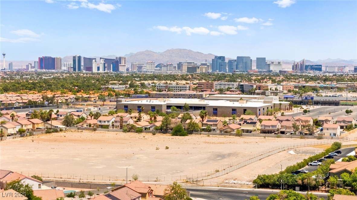 5606 Spring Trellis Street Las Vegas, NV 89113 - Photo 44 of 44 Bird's eye view of skyline and a mountain backdrop