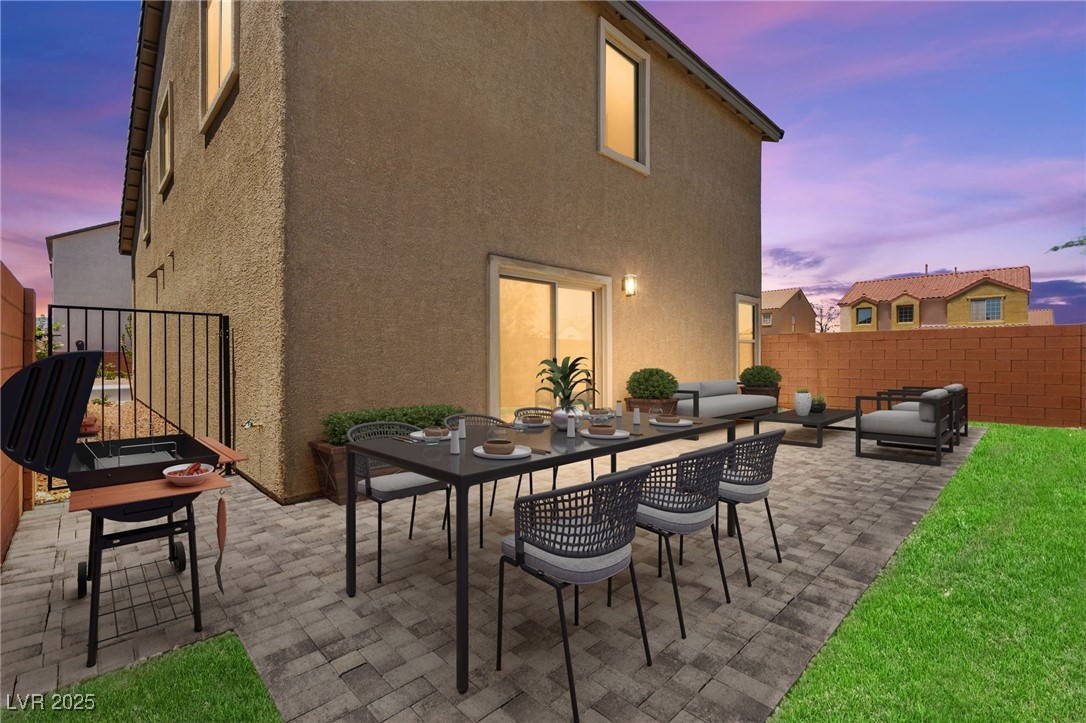 5606 Spring Trellis Street Las Vegas, NV 89113 - Photo 8 of 44 Patio terrace at dusk with a patio and outdoor dining area