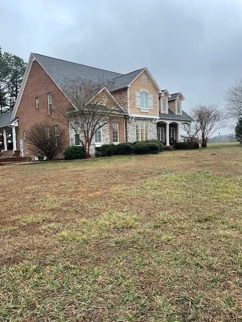 828 Prosser Road Leoma, TN 38468 - Photo 2 of 20 a front view of a house with a yard