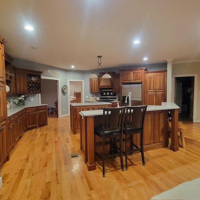 828 Prosser Road Leoma, TN 38468 - Photo 3 of 20 a kitchen with stainless steel appliances kitchen island granite countertop a table chairs sink and cabinets