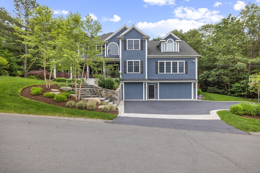 22 Flintlock Road Lexington, MA 02420 - Photo 1 of 1 a front view of a house with a yard