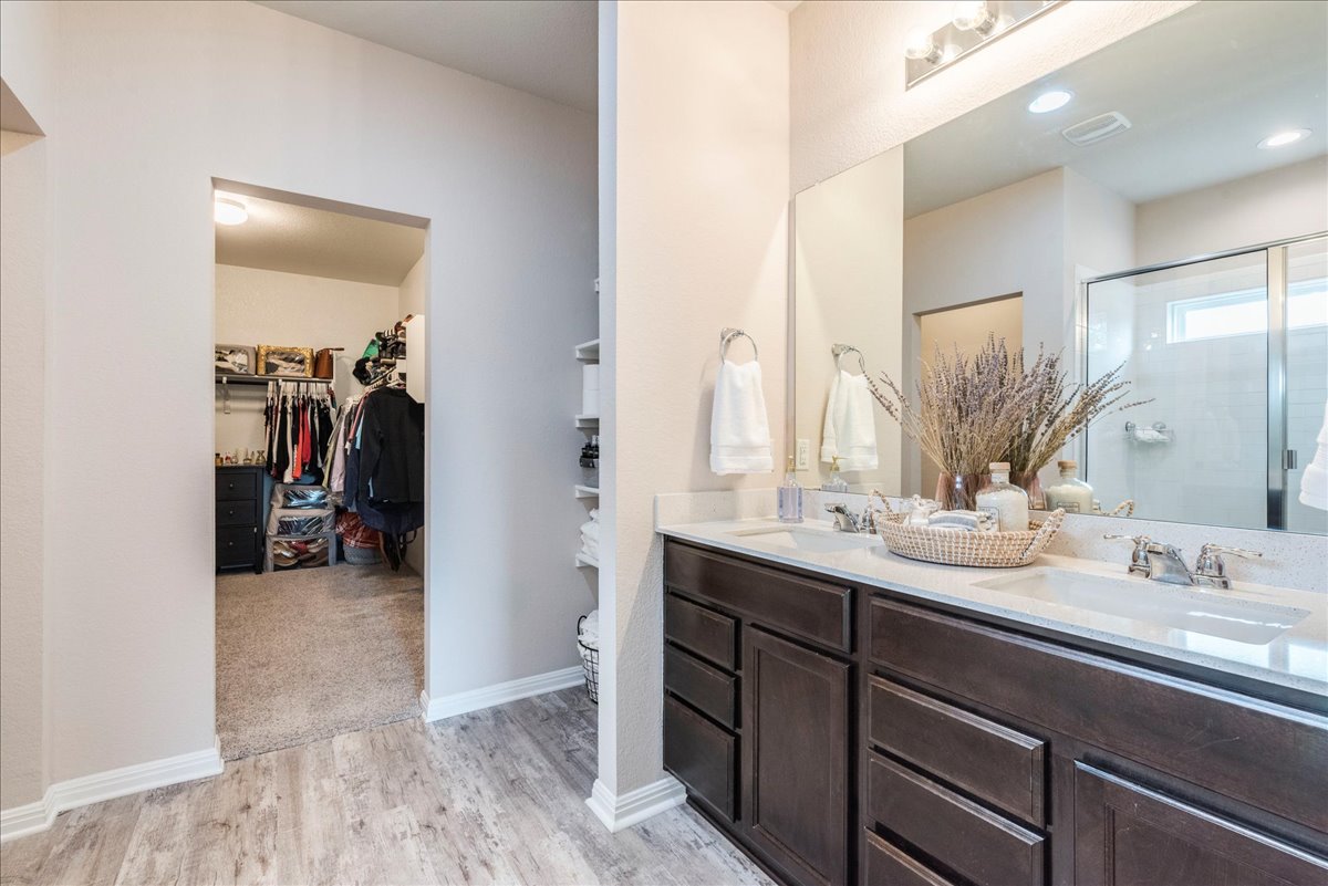 125 Groesbeck Lane Leander, TX 78641 - Photo 17 of 38 a en suite bathroom with a sink and a mirror
