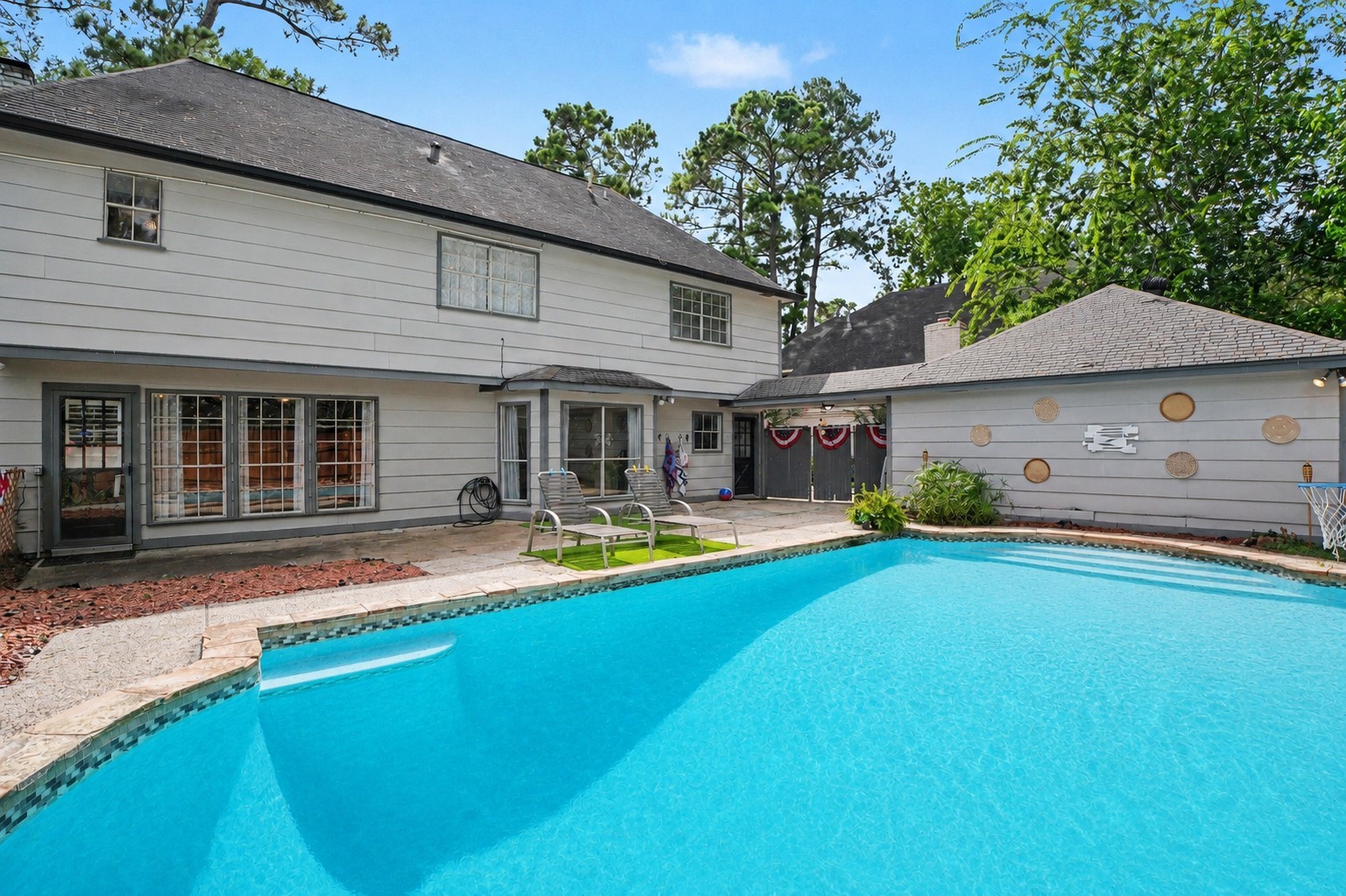 9530 Arcade Drive Spring, TX 77379 - Photo 28 of 32 Expansive look at the backyard pool for both fun-filled days and peaceful evenings.