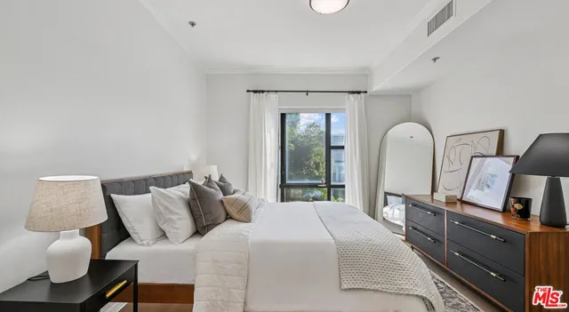 a bedroom with a bed and furniture