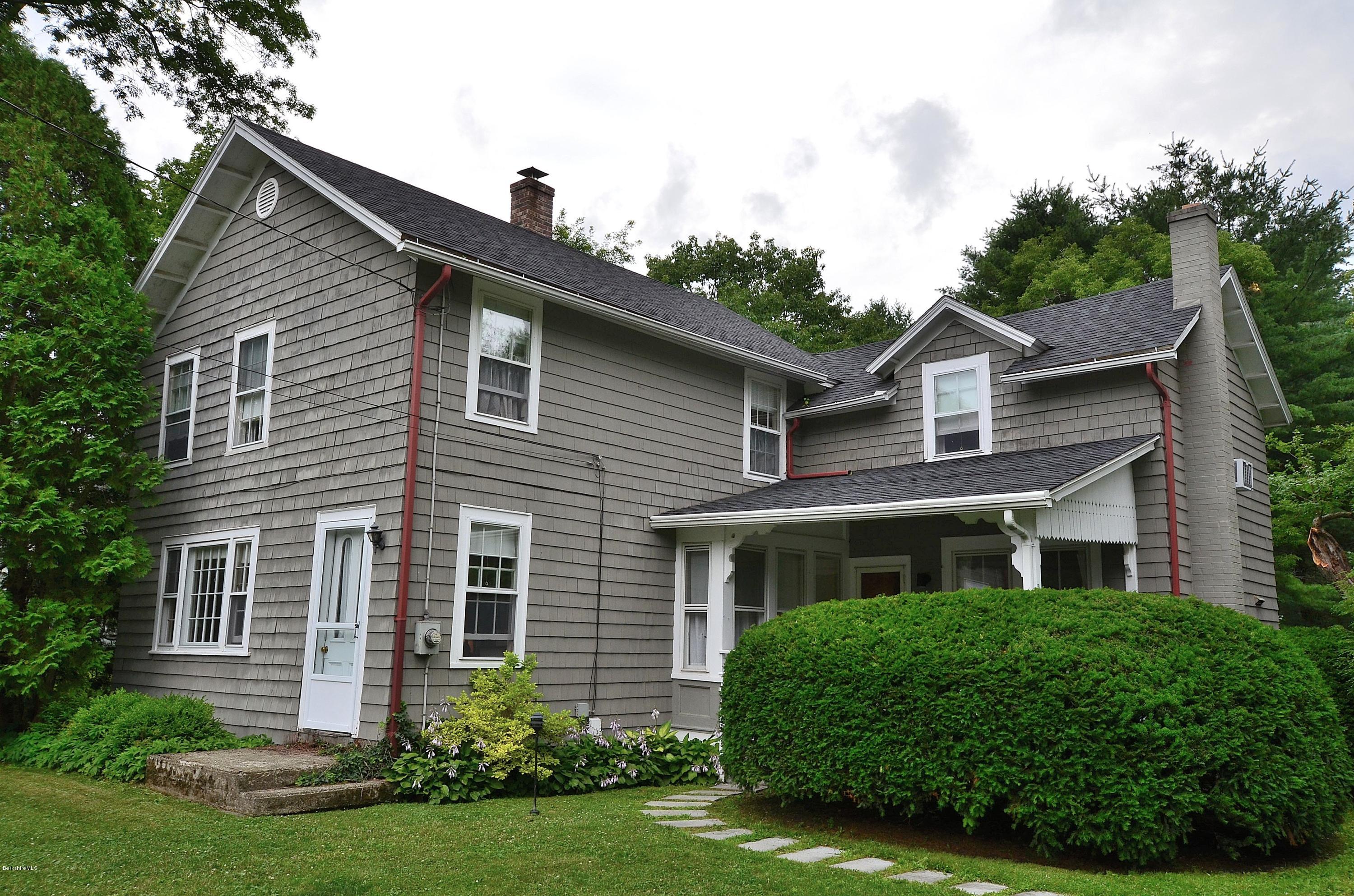 4 Cherry Hill Road Stockbridge, MA 01262 - Photo 1 of 19 a front view of a house with a yard