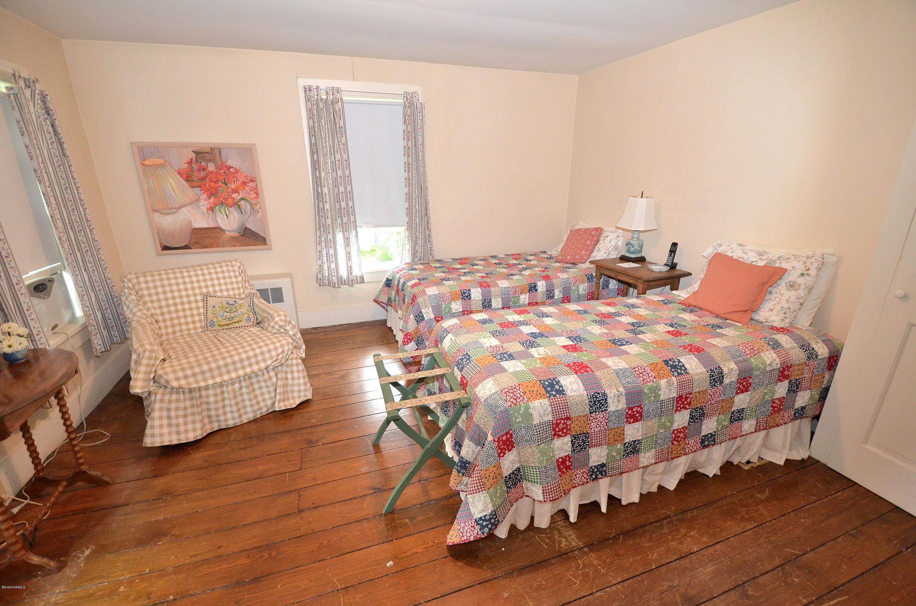 4 Cherry Hill Road Stockbridge, MA 01262 - Photo 11 of 19 a bedroom with a bed and painting on the wall