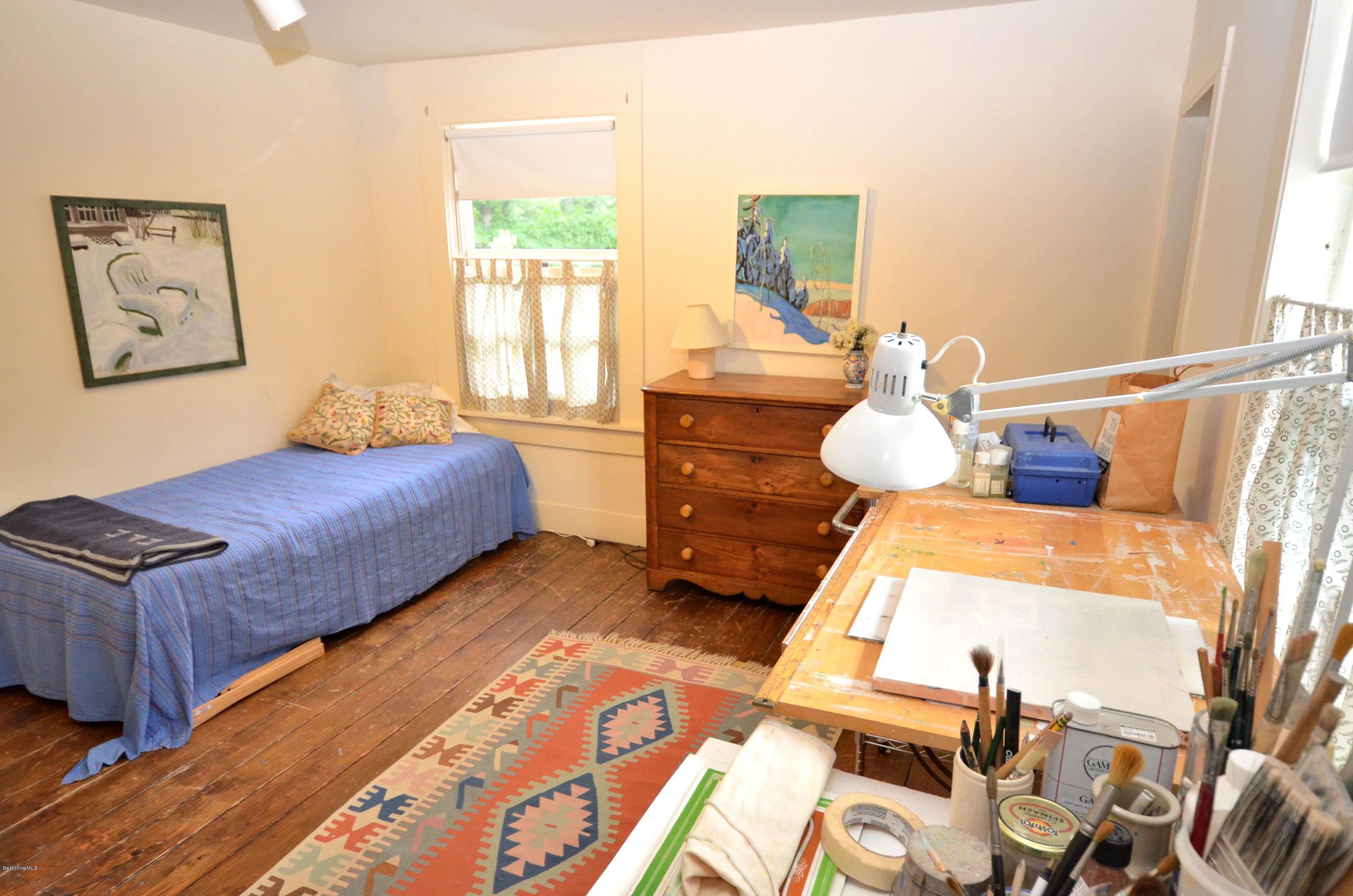 4 Cherry Hill Road Stockbridge, MA 01262 - Photo 12 of 19 a bed room with two bed and a large window