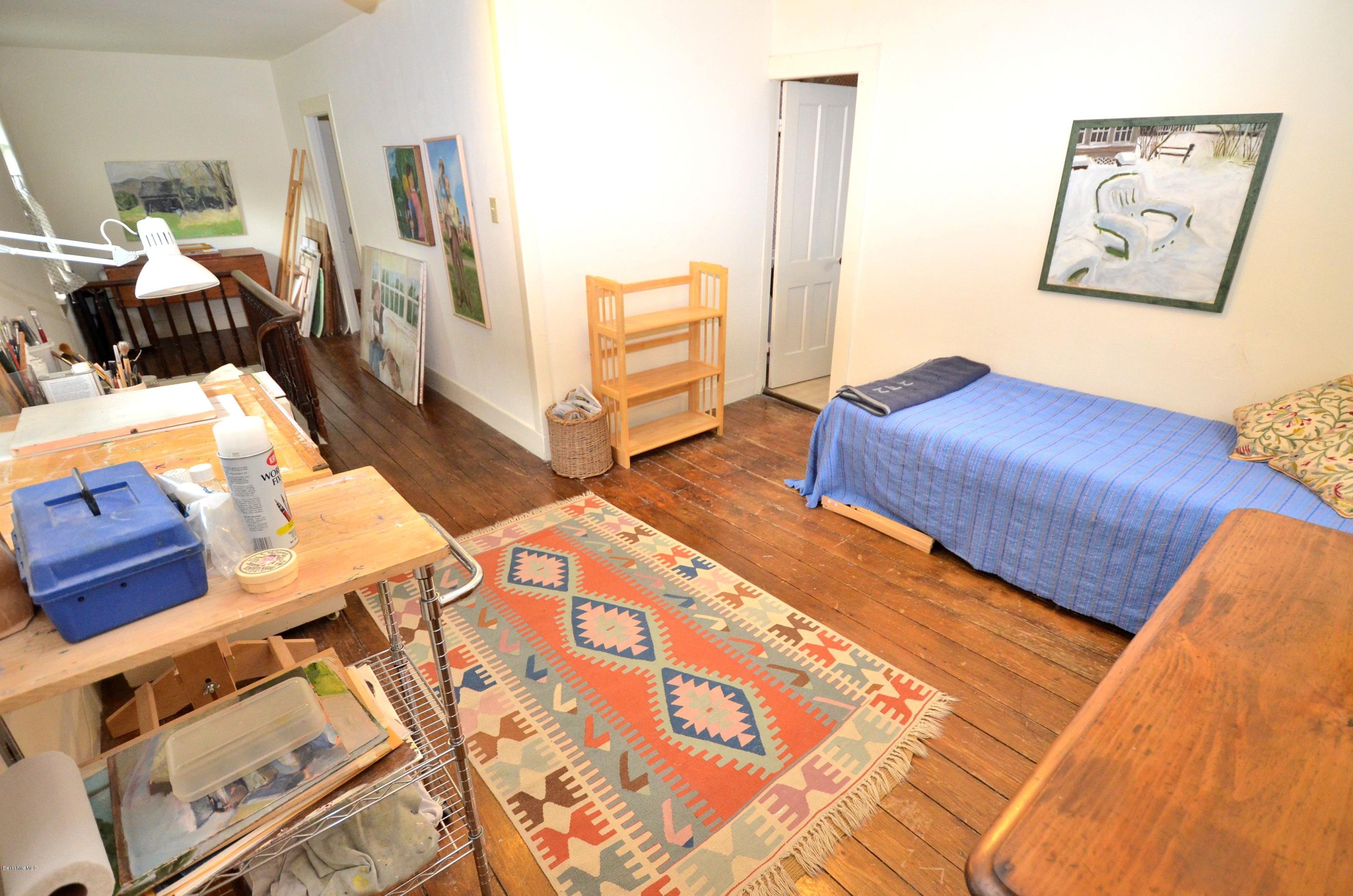 4 Cherry Hill Road Stockbridge, MA 01262 - Photo 13 of 19 a bedroom with a bed and cupboard