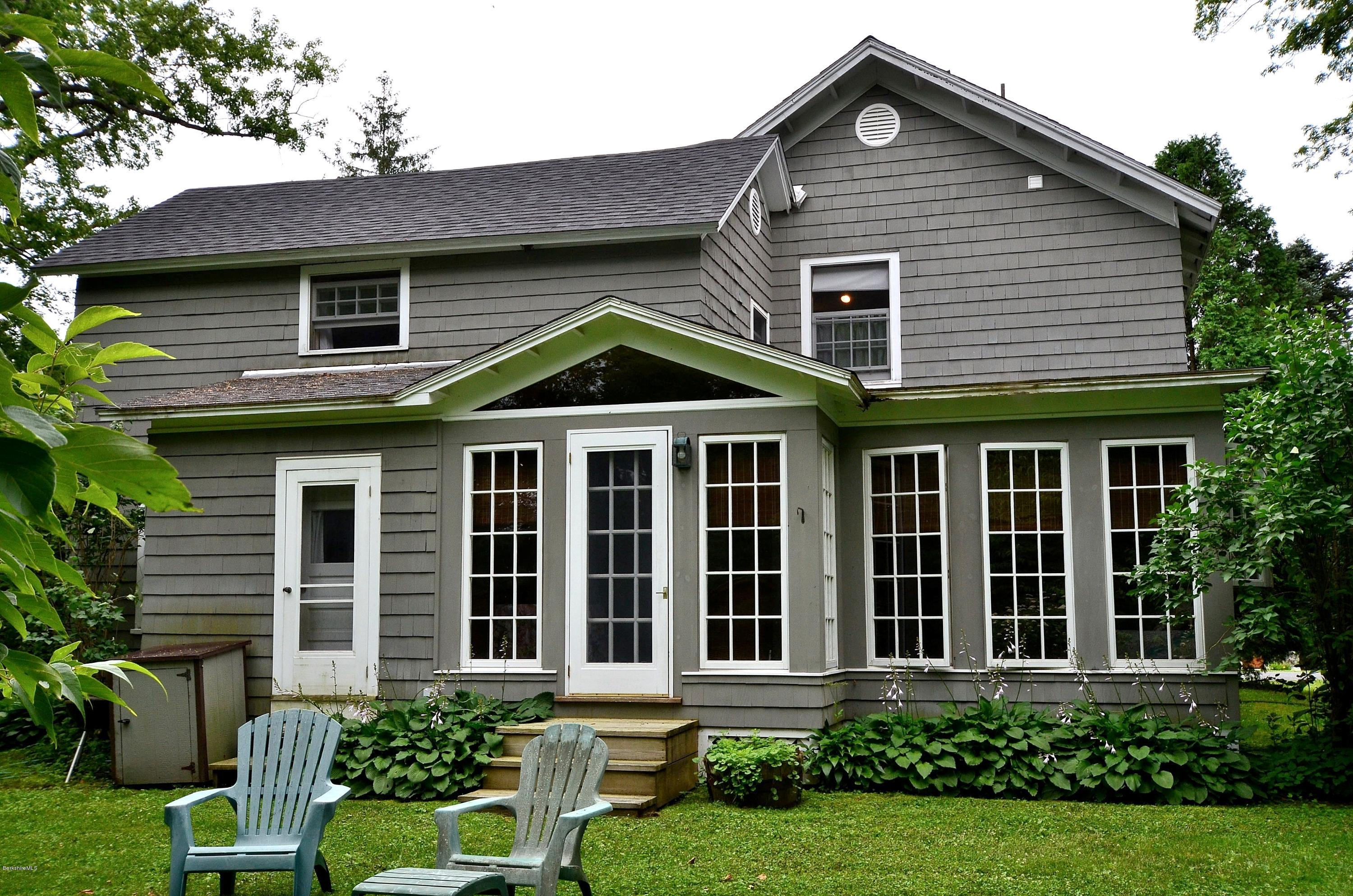 4 Cherry Hill Road Stockbridge, MA 01262 - Photo 16 of 19 a front view of a house with a yard