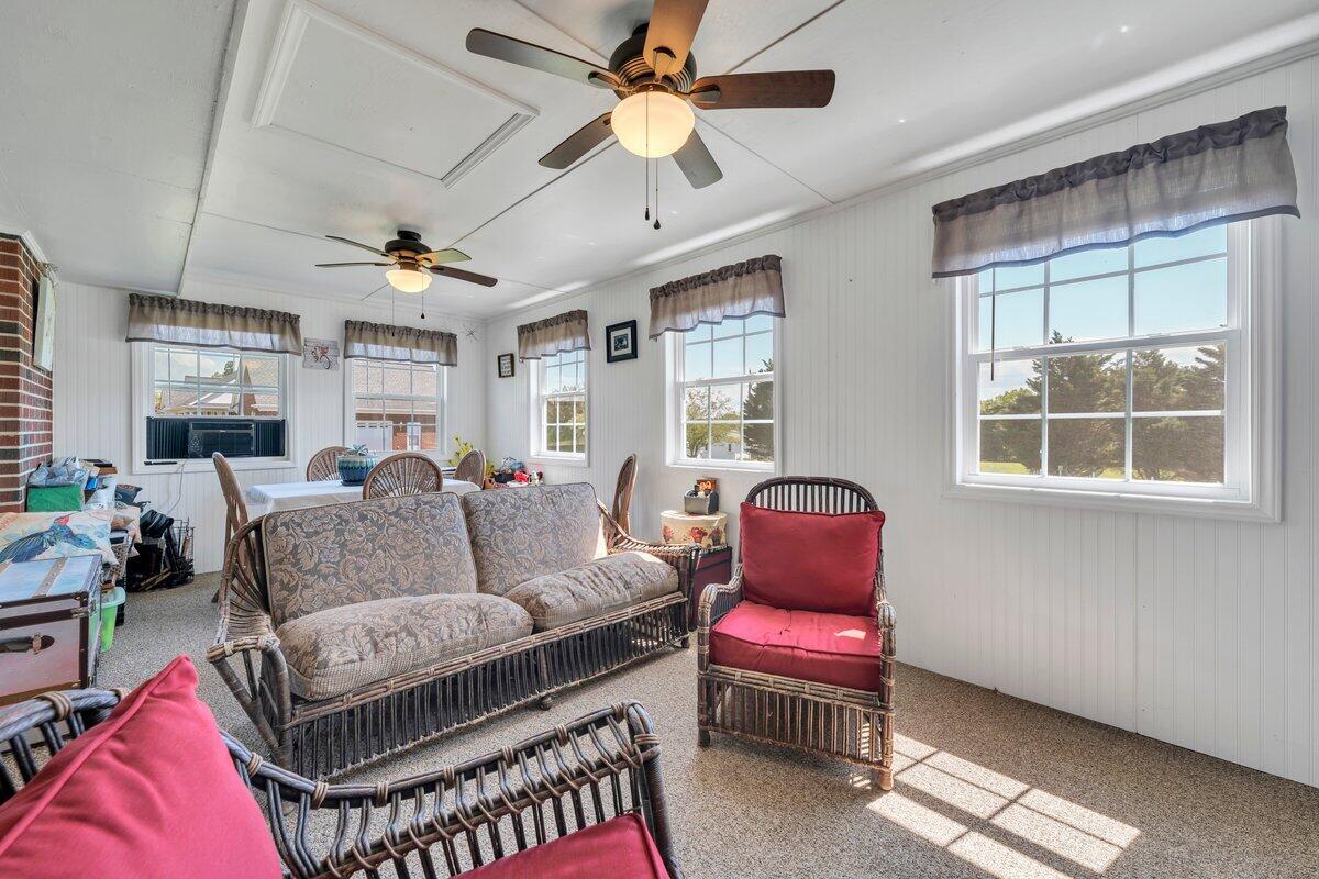 3226 Rakes Road Rocky Mount, VA 24151 - Photo 18 of 74 a living room with furniture a ceiling fan and a window