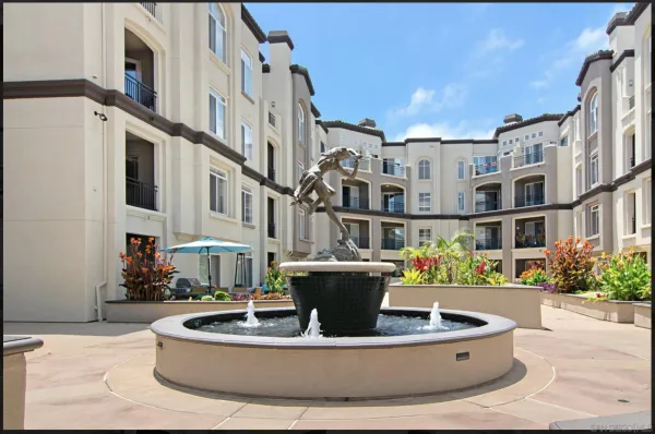 a view of a building with potted plants