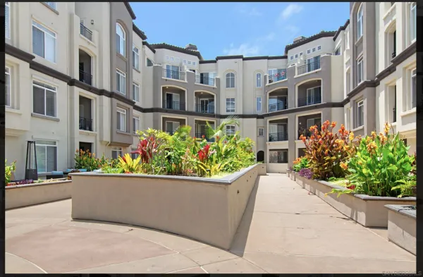 a view of residential houses with outdoor space