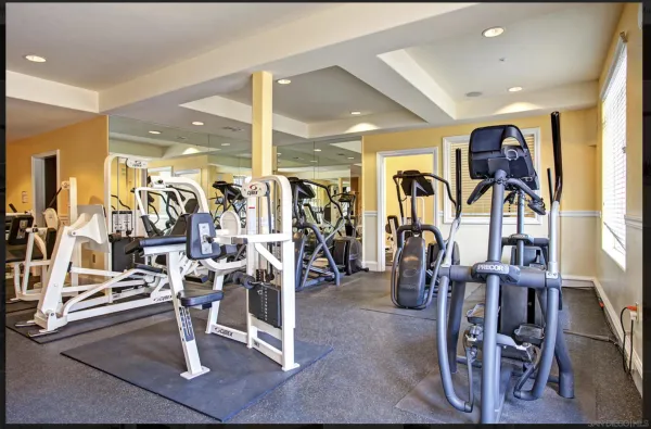 a living room with furniture or couch and a large window