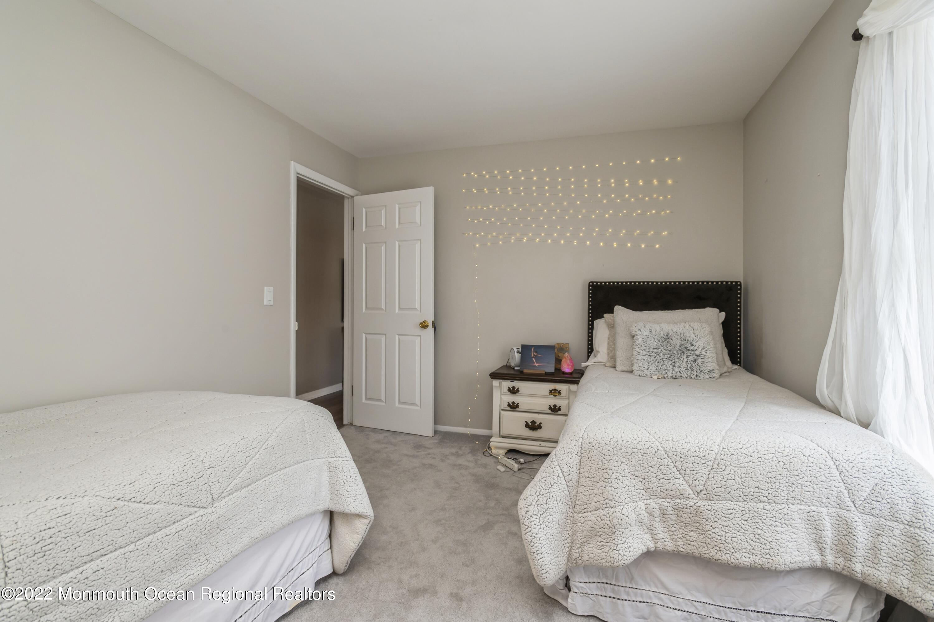 503 Harding Road, Unit 5 Freehold, NJ 07728 - Photo 17 of 21 a bedroom with a bed and a closet