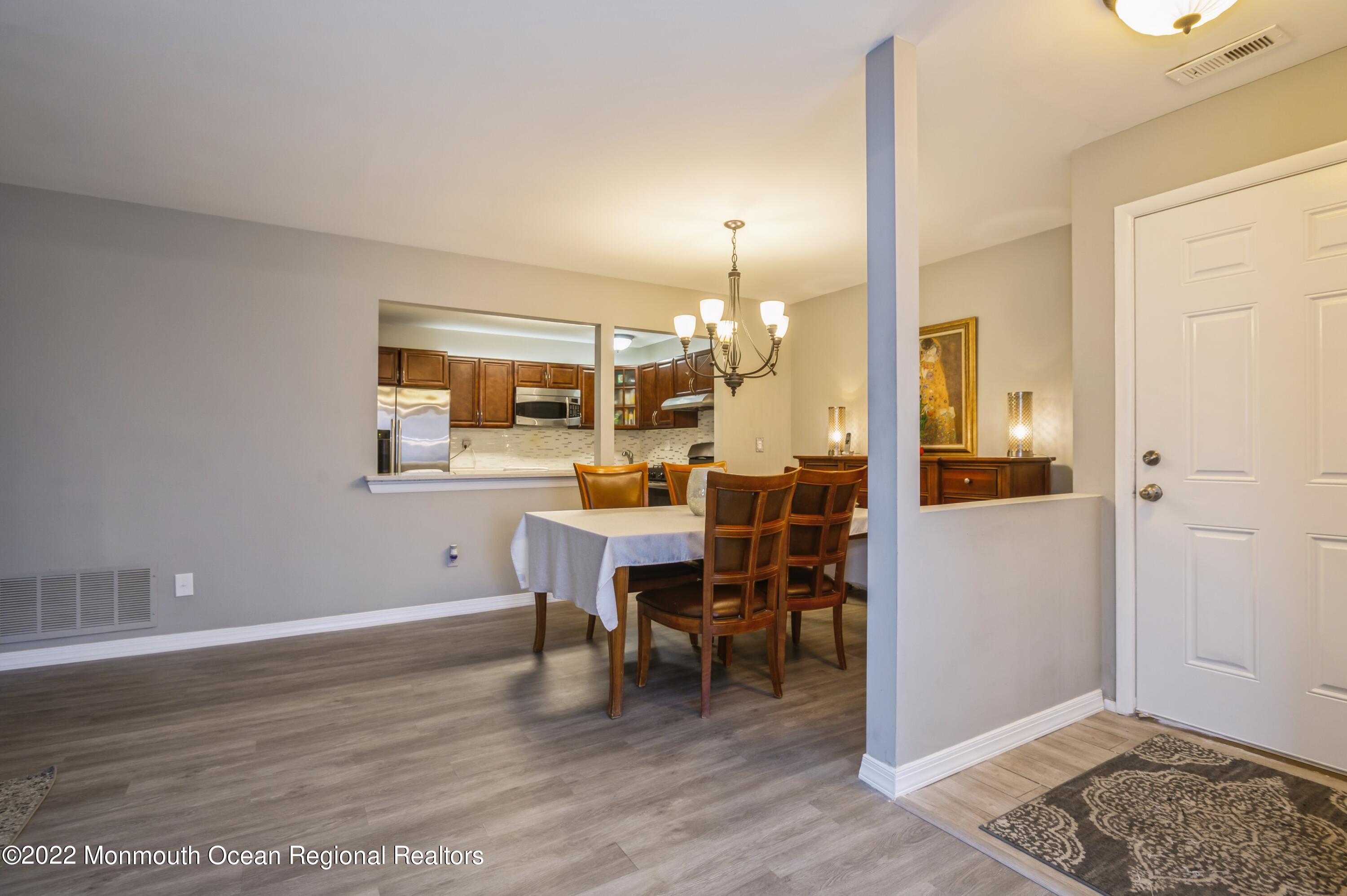 503 Harding Road, Unit 5 Freehold, NJ 07728 - Photo 8 of 21 a dining room with furniture and window