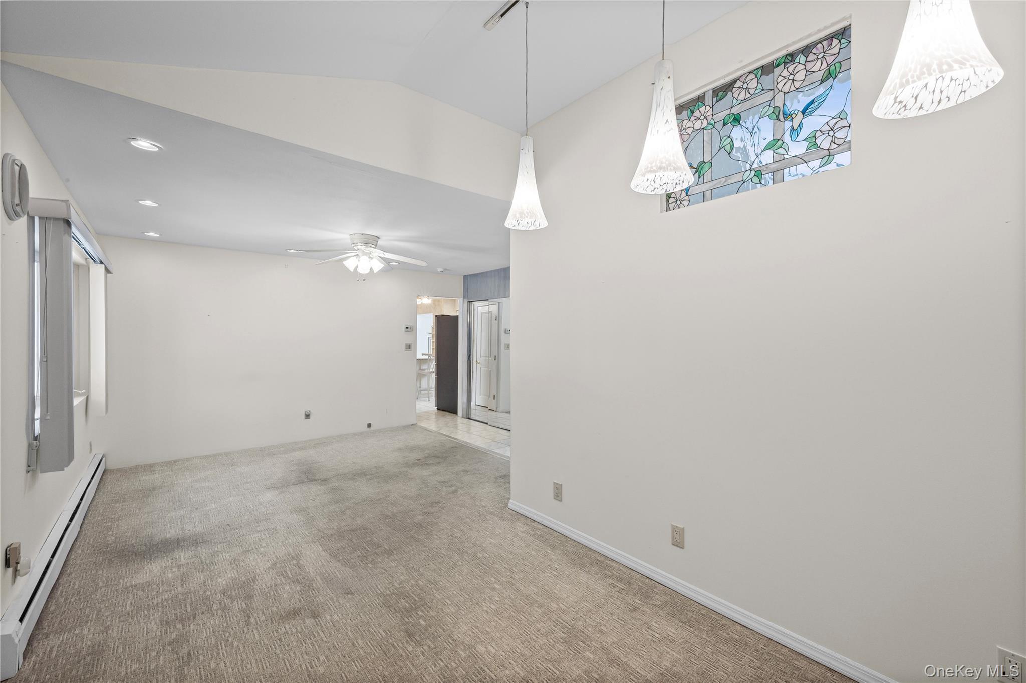 3 Brenner Road Coram, NY 11727 - Photo 20 of 41 a view of a hallway with a refrigerator