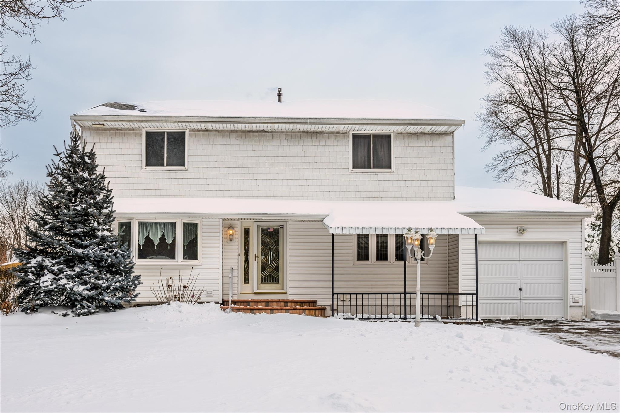 3 Brenner Road Coram, NY 11727 - Photo 2 of 41 a view of a house with a garage