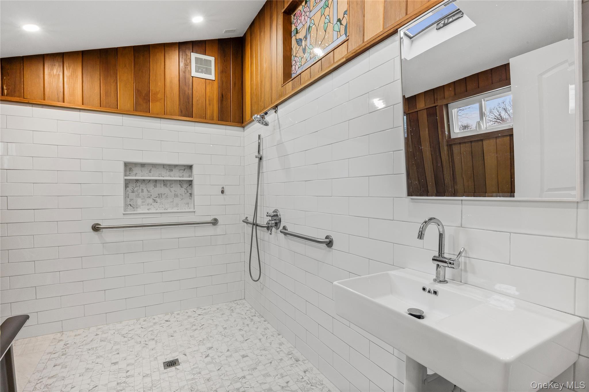 3 Brenner Road Coram, NY 11727 - Photo 21 of 41 a bathroom with a sink and a mirror