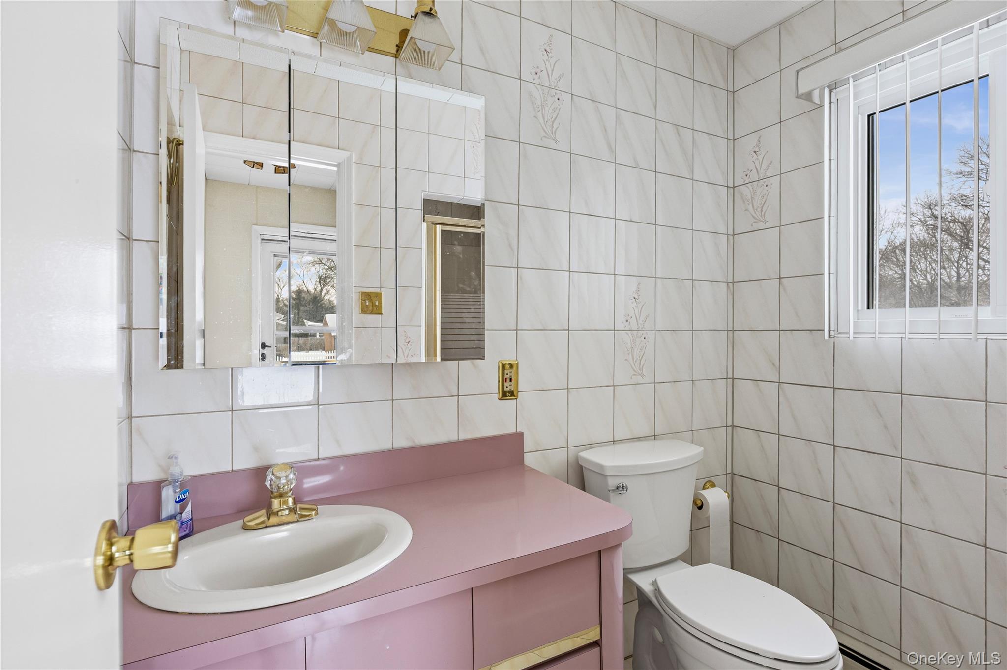 3 Brenner Road Coram, NY 11727 - Photo 22 of 41 a bathroom with a sink toilet and shower