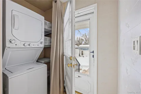 a view of an empty room with a fireplace