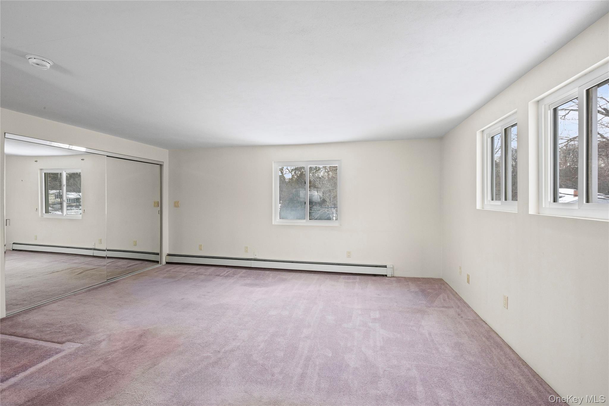 3 Brenner Road Coram, NY 11727 - Photo 25 of 41 an empty room with windows and entrance