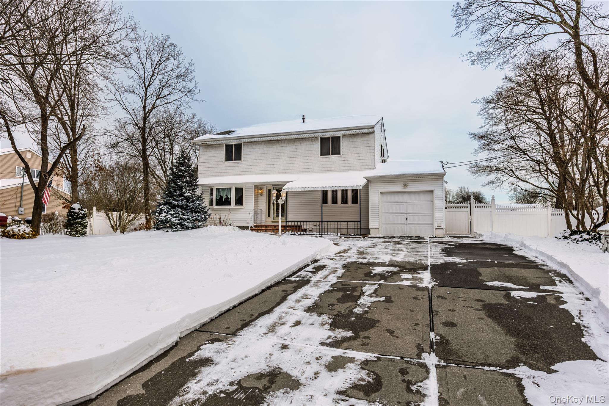 3 Brenner Road Coram, NY 11727 - Photo 3 of 41 a front view of a house with a yard