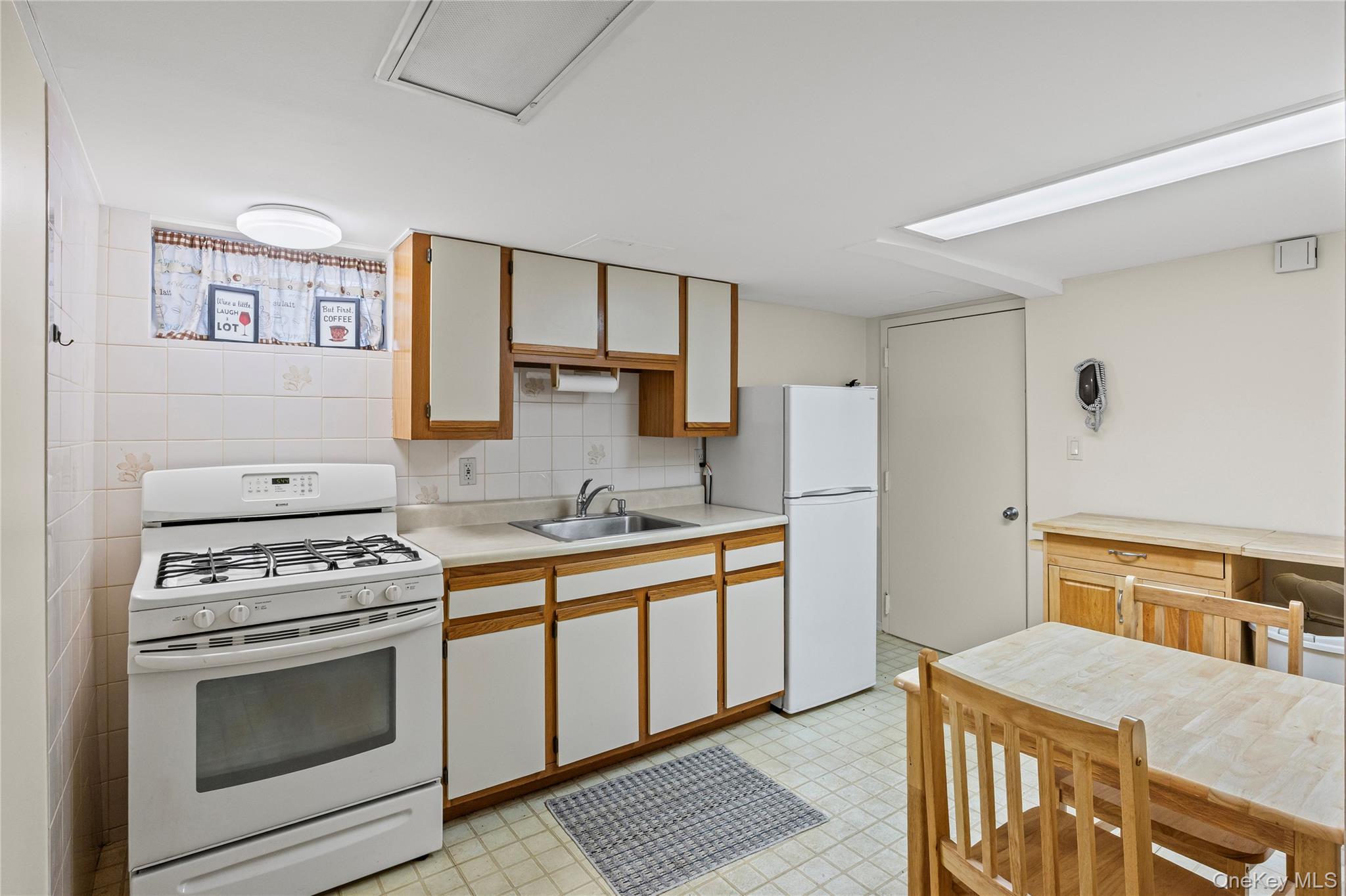 3 Brenner Road Coram, NY 11727 - Photo 35 of 41 a kitchen with stainless steel appliances granite countertop a stove and a refrigerator